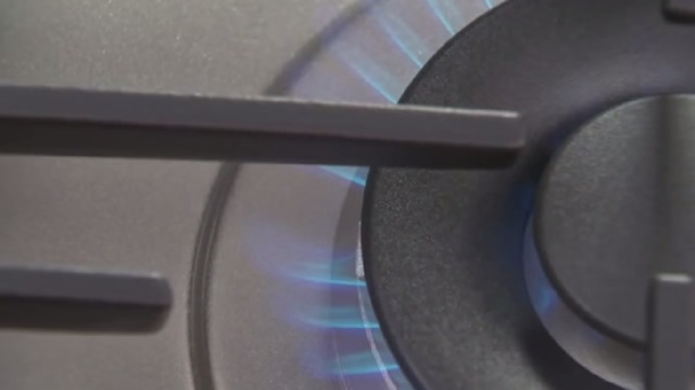 A gas hob burning with a blue flame